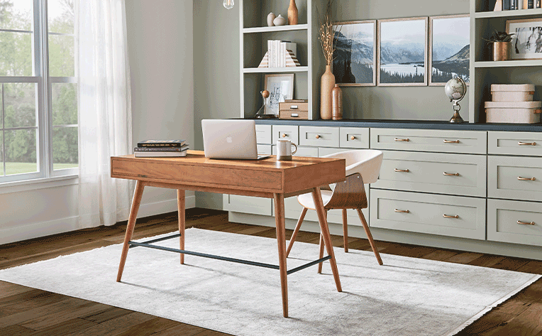 modern home office with hardwood flooring and neutral area rug