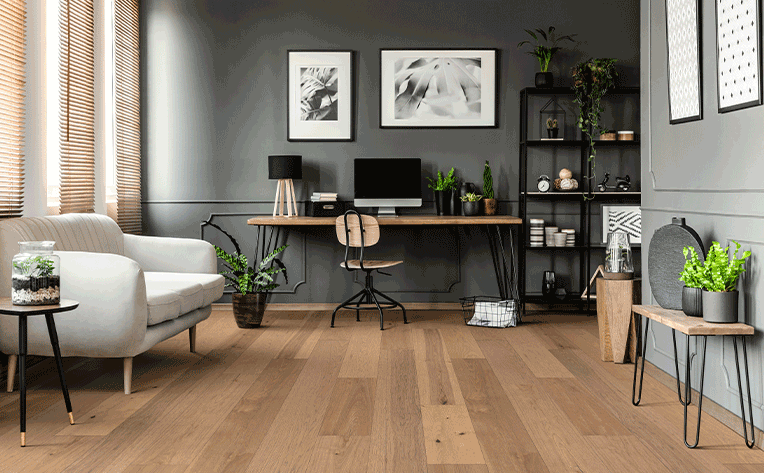 wide plank hardwood flooring in home office with greenery